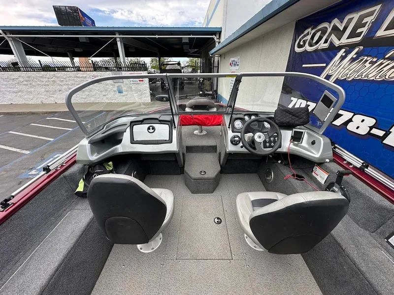 Slide: The Image of 2018 Tracker Pro Guide V-175 Combo boat interior with dual seats and steering console. - 11