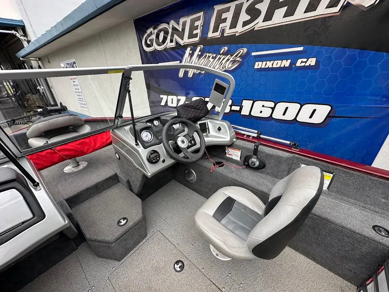 Slide: The Image of 2018 Tracker Pro Guide V-175 Combo boat interior with steering console and seating. - 13