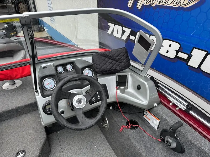 Slide: The Image of 2018 Tracker Pro Guide V-175 Combo boat dashboard with steering wheel and instrument panel. - 14