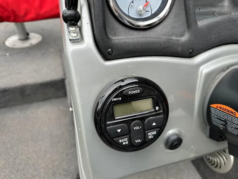 Slide: The Image of Control panel of 2018 Tracker Pro Guide V-175 Combo boat with gauge and buttons. - 17