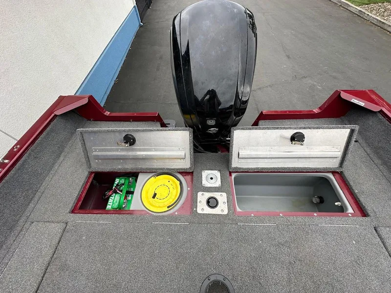 Slide: The Image of 2018 Tracker Pro Guide V-175 Combo boat storage compartments and motor, viewed from above. - 27