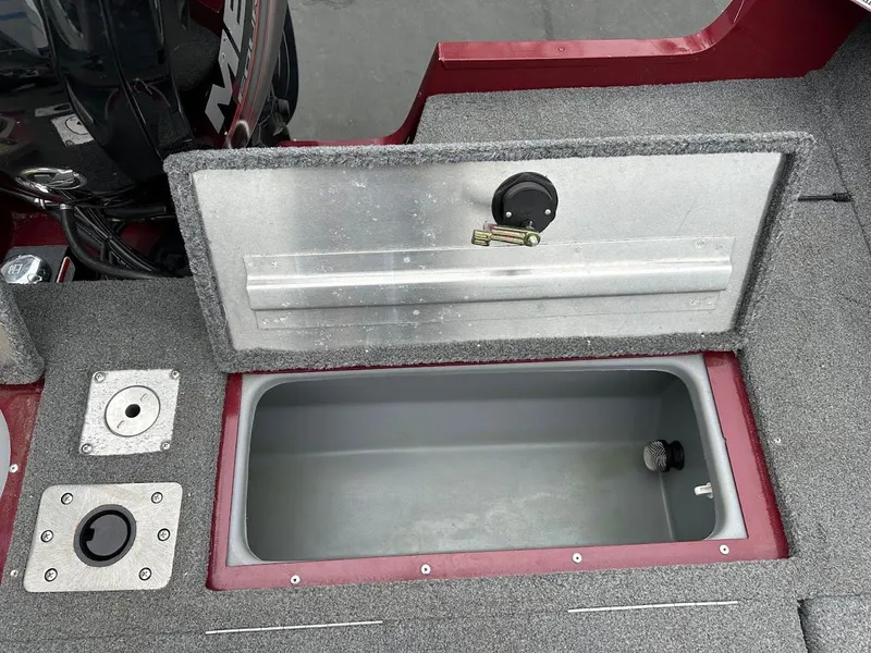 Slide: The Image of 2018 Tracker Pro Guide V-175 Combo boat storage compartment with open lid. - 28