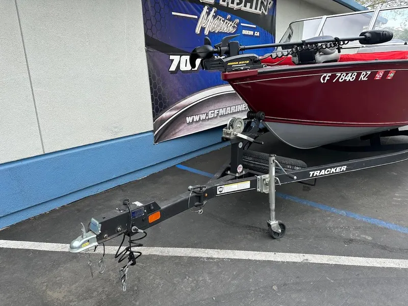 Slide: The Image of 2018 Tracker Pro Guide V-175 Combo boat on trailer, parked outdoors. - 3