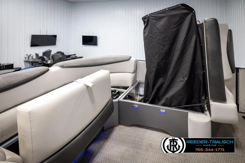 Slide: The Image of 2020 Avalon 2385 CAT EL interior with covered equipment, modern seating, and blue LED lighting. - 16