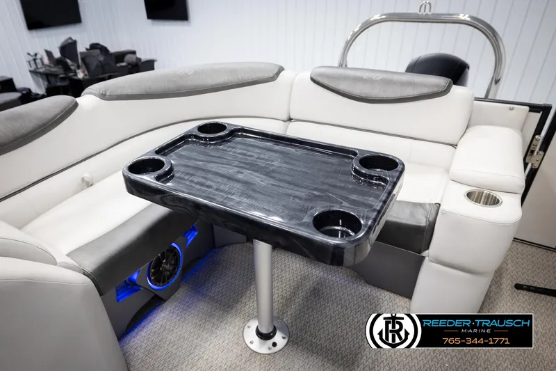 Slide: The Image of 2020 Avalon 2385 CAT EL boat interior with sleek seating and a central table. - 17