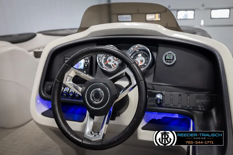 Slide: The Image of Steering console of 2020 Avalon 2385 CAT EL boat with illuminated dashboard. - 24