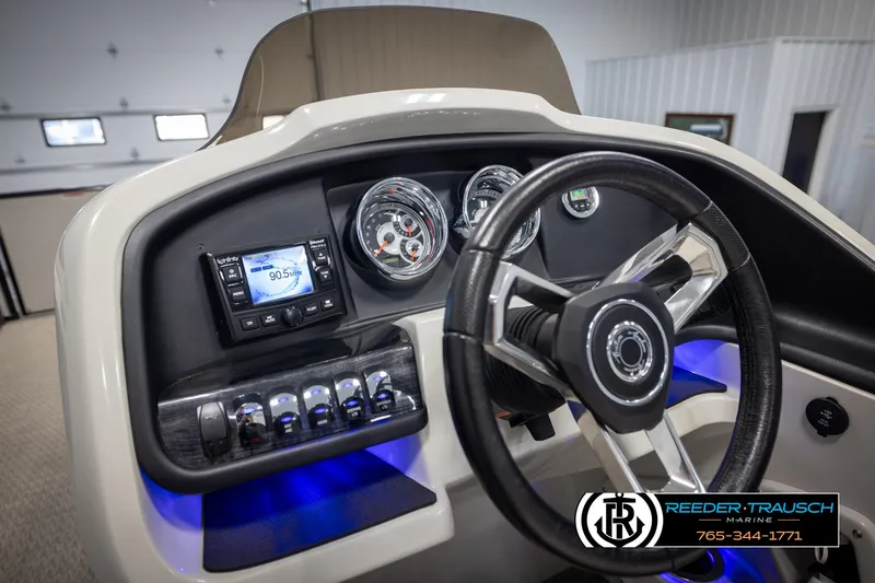 Slide: The Image of 2020 Avalon 2385 CAT EL boat dashboard with steering wheel and illuminated controls. - 25