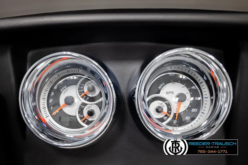 Slide: The Image of Dashboard gauges of a 2020 Avalon 2385 CAT EL boat, featuring speedometer and fuel indicators. - 29