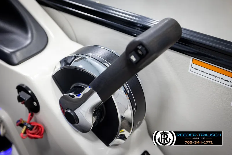 Slide: The Image of Throttle control lever on a 2020 Avalon 2385 CAT EL boat dashboard. - 33