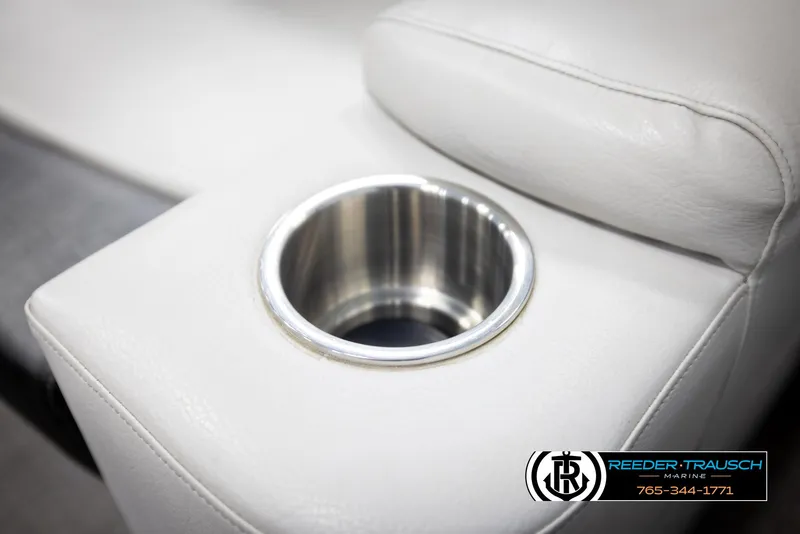 Slide: The Image of Cup holder on Avalon 2385 CAT EL 2020 boat's white leather seating. - 37