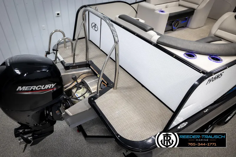 Slide: The Image of Avalon 2385 CAT EL 2020 boat with Mercury engine, interior seating, and Reeder-Trausch Marine logo. - 43