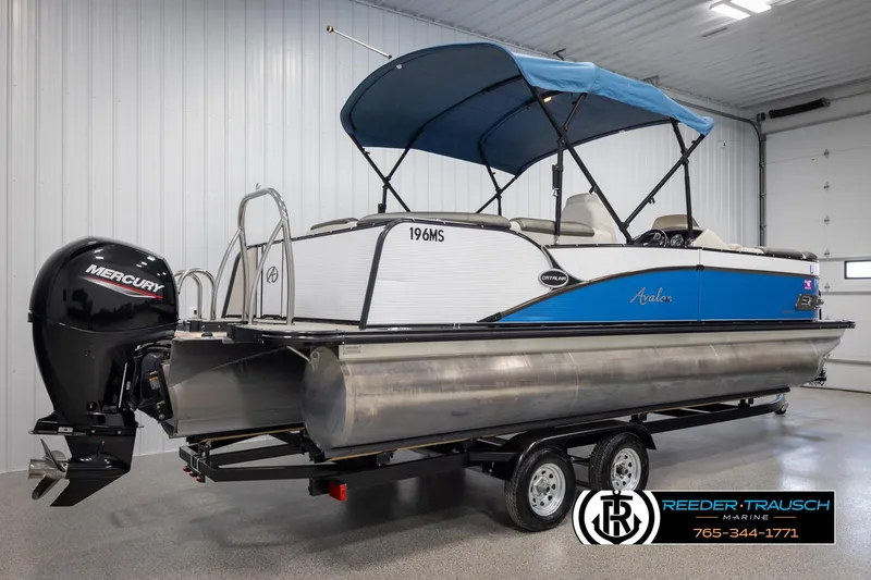 Slide: The Image of 2020 Avalon 2385 CAT EL pontoon boat with Mercury engine on trailer in showroom. - 6