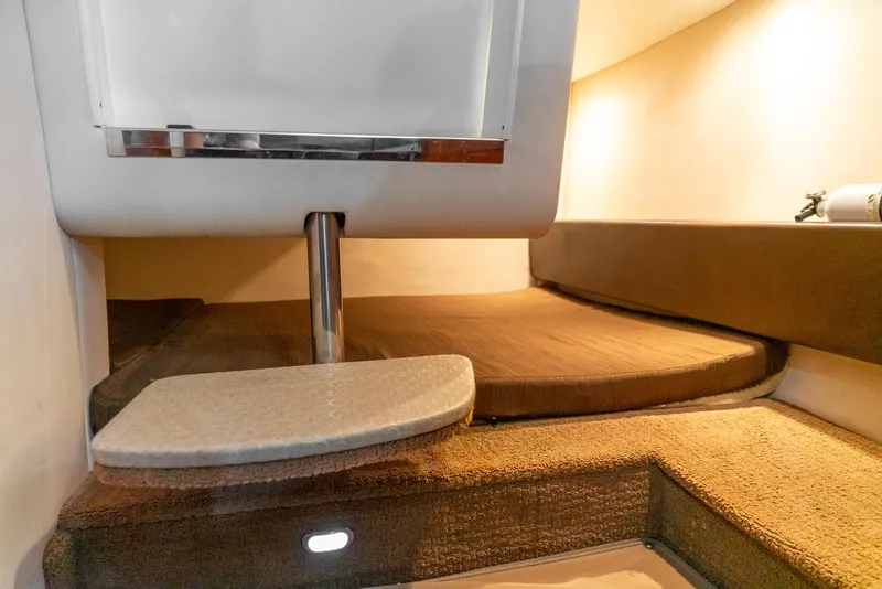 Slide: The Image of 2014 Sea Ray 260 Sundancer cabin interior with cozy seating and modern design. - 32