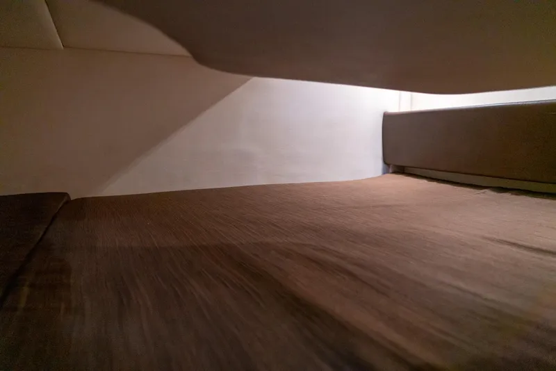 Slide: The Image of Interior cabin view of 2014 Sea Ray 260 Sundancer, showcasing cozy sleeping area. - 34