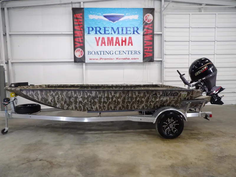 Slide: The Image of 2025 Avid 18 Commander boat with camouflage design at Premier Yamaha Boating Center. - 1