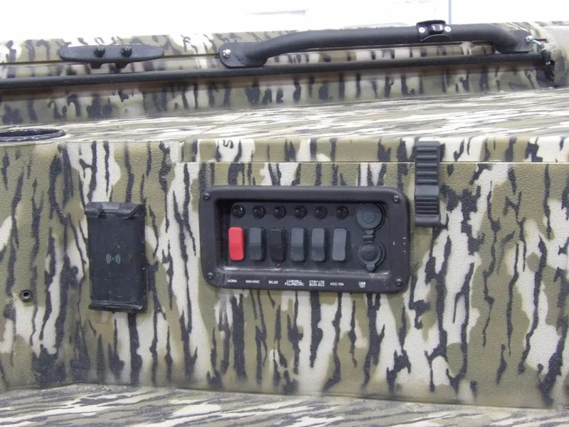 Slide: The Image of Camouflage control panel on 2025 Avid 18 Commander boat. - 16