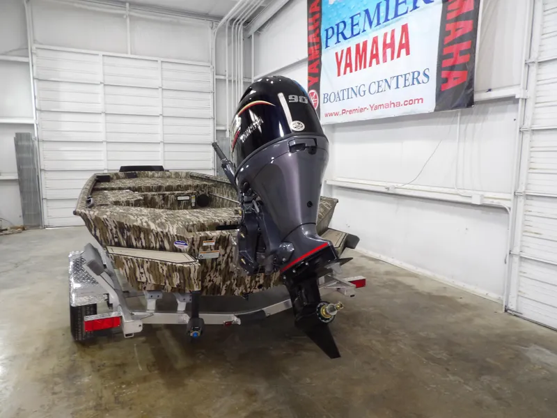 Slide: The Image of 2025 Avid 18 Commander boat with Yamaha outboard motor in showroom. - 8