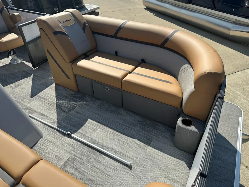 Slide: The Image of 2024 Crest Classic LX 220 SLSC boat interior with tan and gray seating. - 3