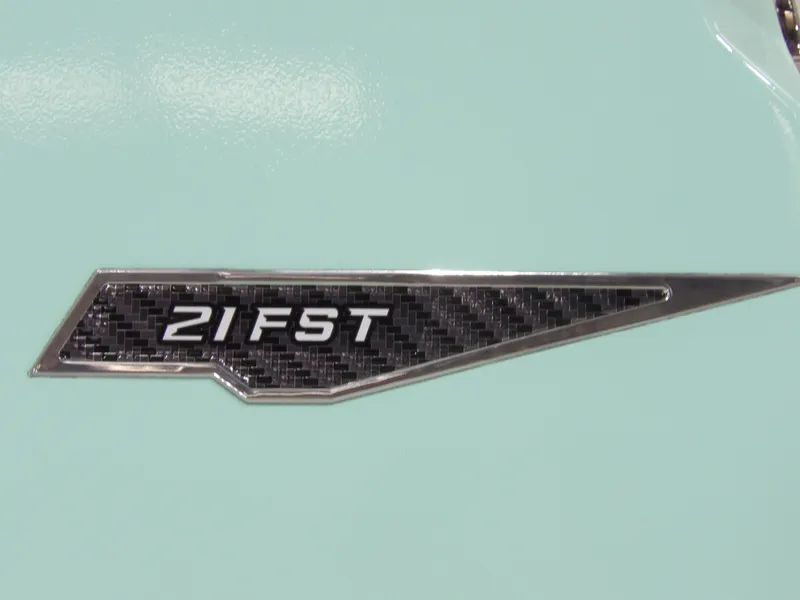 Slide: The Image of 2025 Avid 21FST emblem on light blue background, featuring sleek carbon fiber design. - 6