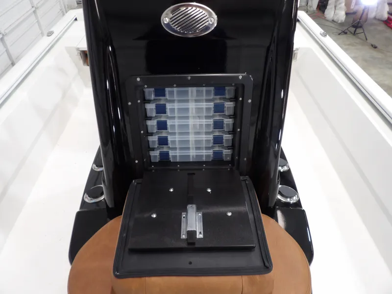 Slide: The Image of Avid 21FST 2025 boat console with storage compartments and seating. - 13