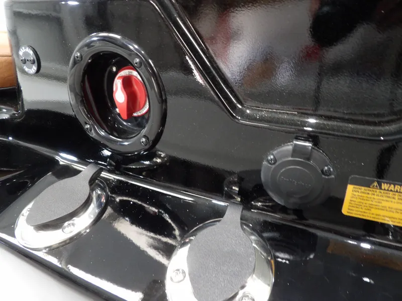 Slide: The Image of Control panel of 2025 Avid 21FST boat with switches and warning label. - 22