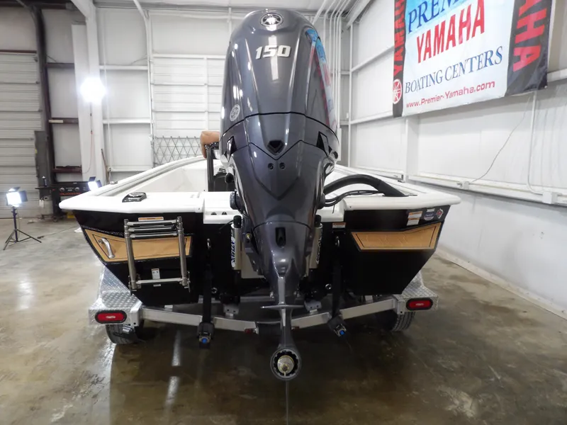Slide: The Image of Avid 21FST 2025 boat with Yamaha 150 engine in showroom. - 8