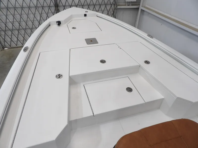 Slide: The Image of Avid 21FST 2025 boat deck with storage compartments and sleek design. - 9