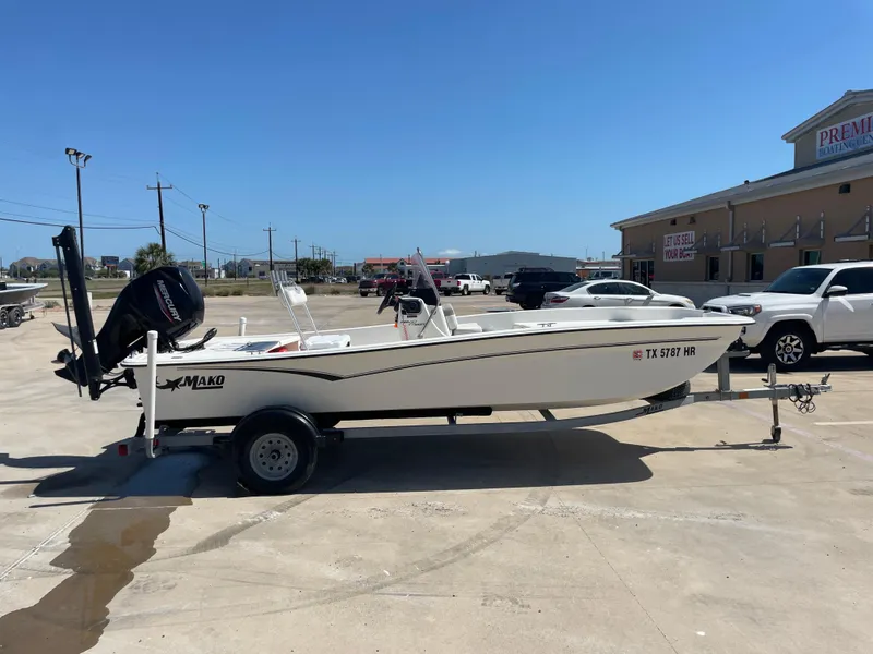 Slide: The Image of 2020 Mako Pro Skiff 17 boat on trailer in parking lot, sunny day. - 5