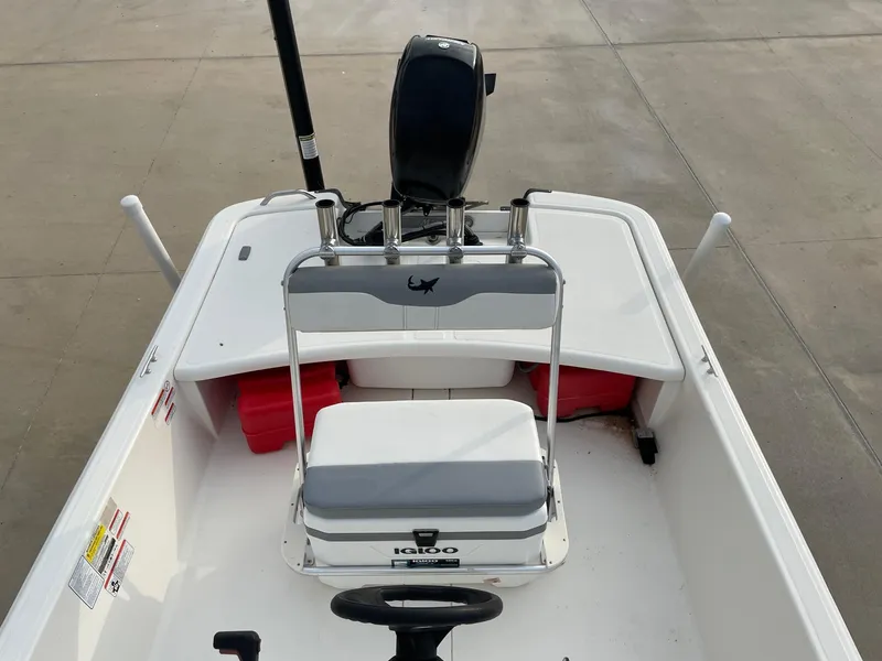 Slide: The Image of 2020 Mako Pro Skiff 17 boat interior with seating and storage compartments. - 9