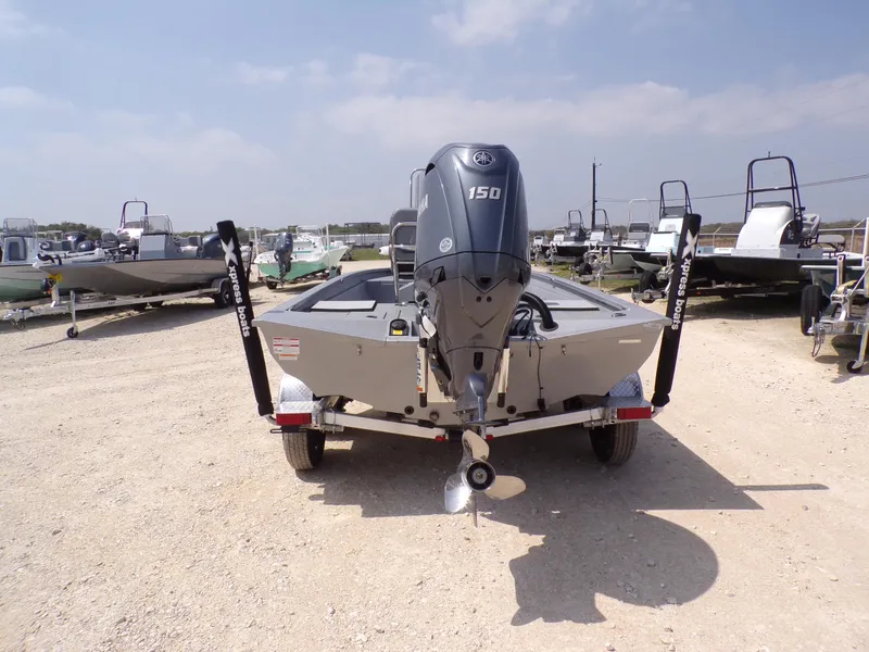 Slide: The Image of 2025 Xpress H210BAY boat with Yamaha 150 engine, displayed outdoors on a trailer. - 10