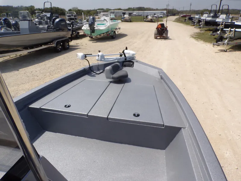 Slide: The Image of 2025 Xpress H210BAY boat on display at a dealership, surrounded by other boats. - 13