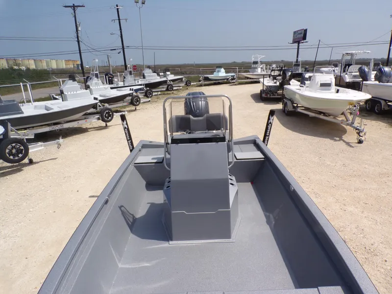 Slide: The Image of 2025 Xpress H210BAY boat on display at a dealership, surrounded by other boats. - 17