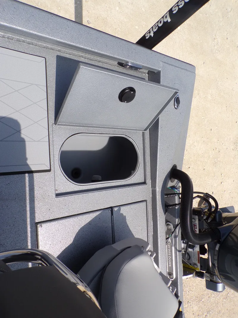 Slide: The Image of 2025 Xpress H210BAY boat interior with storage compartment and seating. - 25