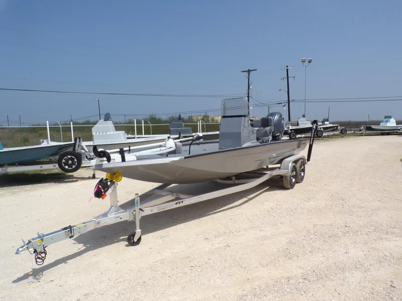 Slide: The Image of 2025 Xpress H210BAY boat on trailer in outdoor lot, clear sky background. - 3