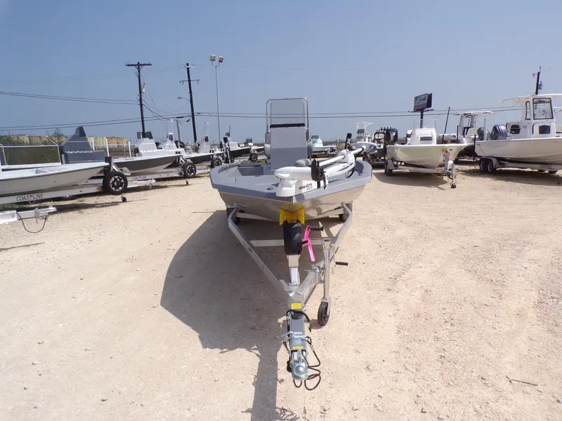 Slide: The Image of 2025 Xpress H210BAY boat on trailer in outdoor dealership lot. - 5