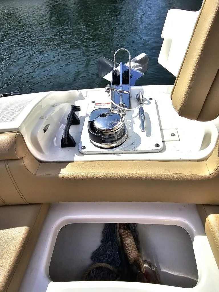 Slide: The Image of 2018 Sea Ray SDX 290 Outboard boat interior with anchor storage and seating. - 18