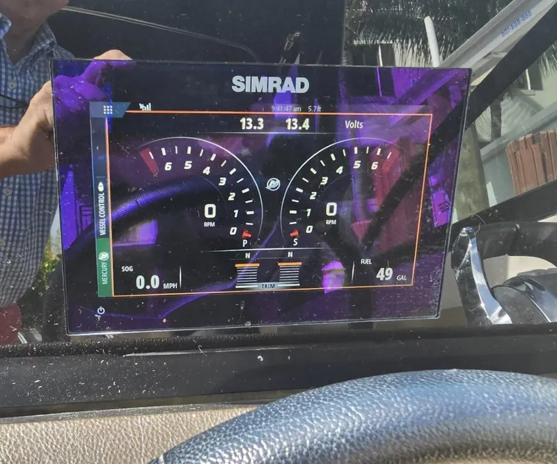 Slide: The Image of Simrad display on 2018 Sea Ray SDX 290 Outboard showing gauges and volt readings. - 20
