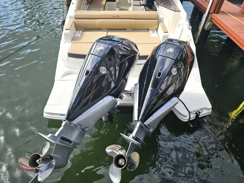 Slide: The Image of 2018 Sea Ray SDX 290 Outboard with dual engines docked by wooden pier. - 4