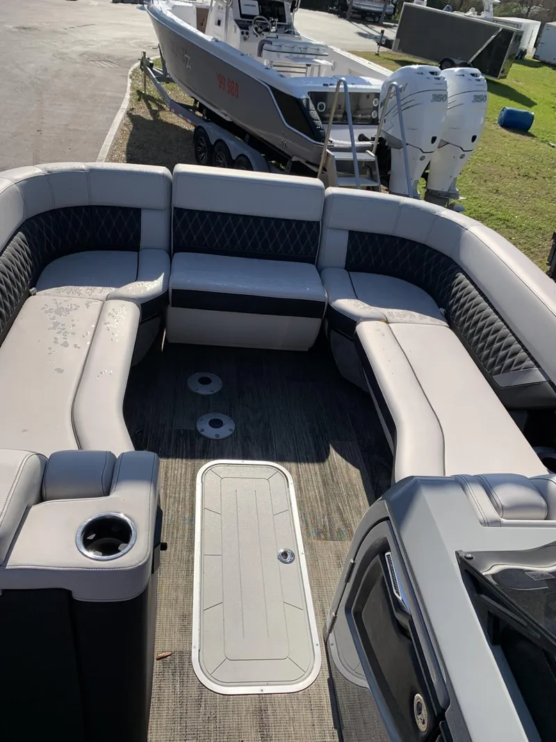 Slide: The Image of 2023 Godfrey San Pan 2700 DFLC pontoon boat with spacious seating and modern design. - 2