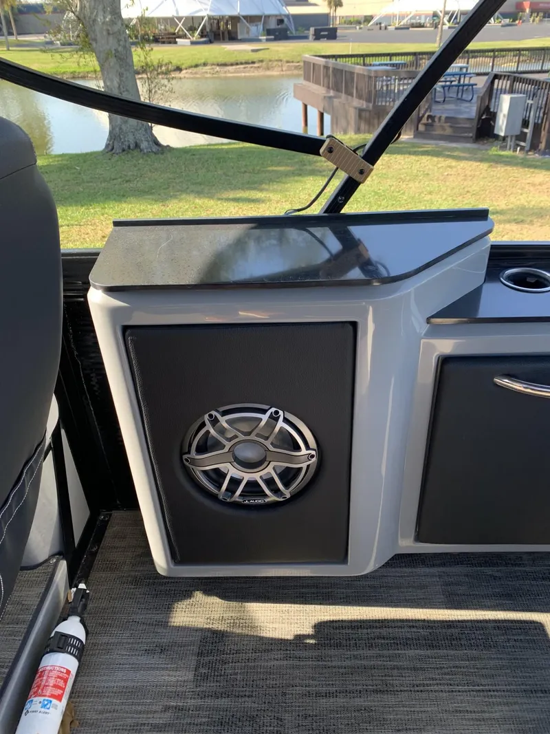 Slide: The Image of 2023 Godfrey San Pan 2700 DFLC boat interior with speaker and fire extinguisher. - 4