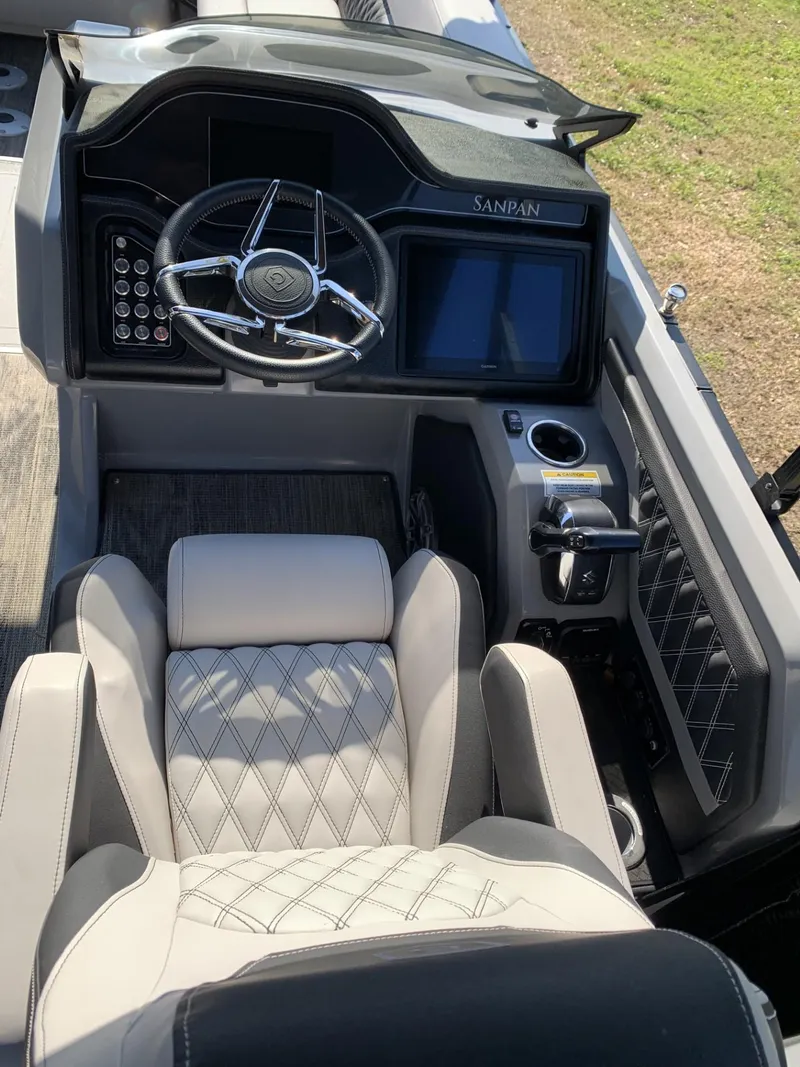 Slide: The Image of Captain's seat and dashboard of 2023 Godfrey San Pan 2700 DFLC boat. - 5