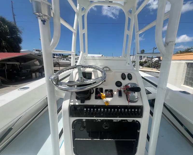 Slide: The Image of 2007 Young Boats Young 24 center console with steering wheel and control panel. - 20