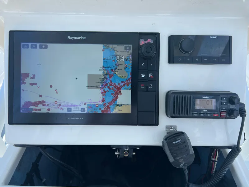 Slide: The Image of Navigation and communication equipment on a 2007 Young Boats Young 24 console. - 9