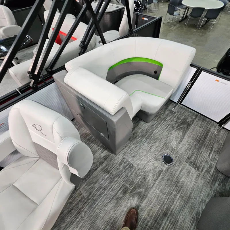 Slide: The Image of Interior of 2025 Qwest E 18 RLS boat with modern seating and flooring. - 15