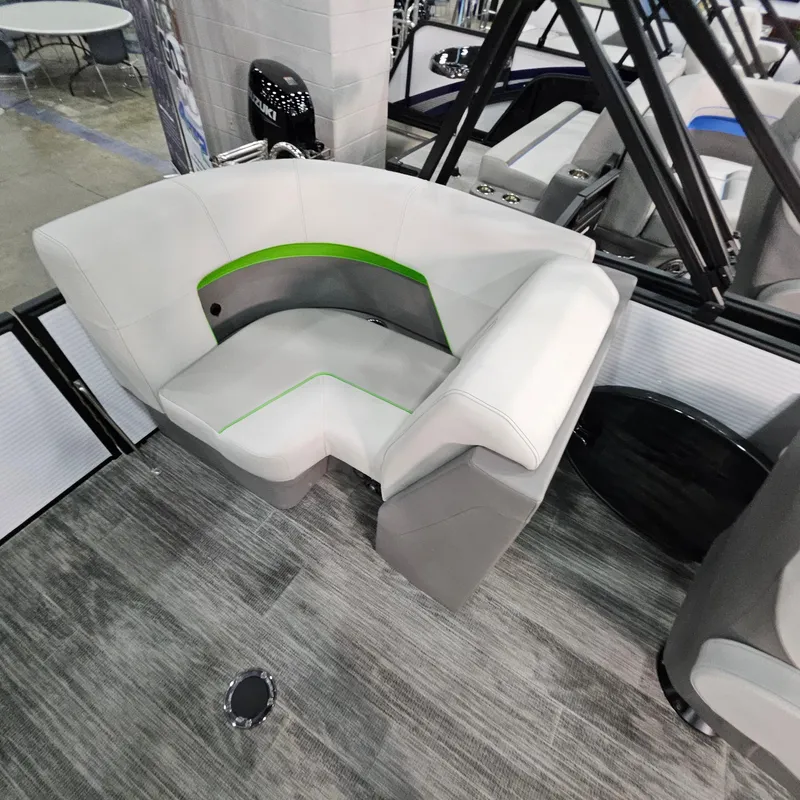 Slide: The Image of Modern seating area on 2025 Qwest E 18 RLS boat with gray and green accents. - 16