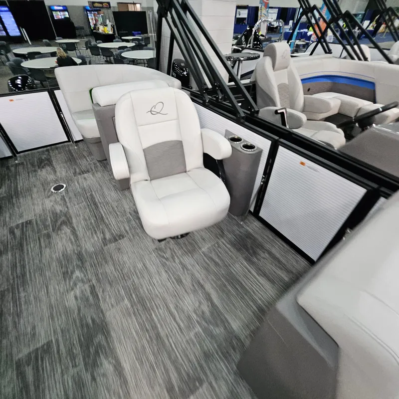 Slide: The Image of Luxurious interior of 2025 Qwest E 18 RLS boat with plush seating and modern design. - 8