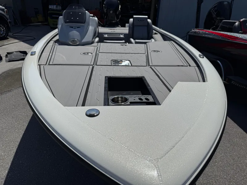 Slide: The Image of 2025 Avid 18 XB boat with sleek design and spacious deck layout. - 5