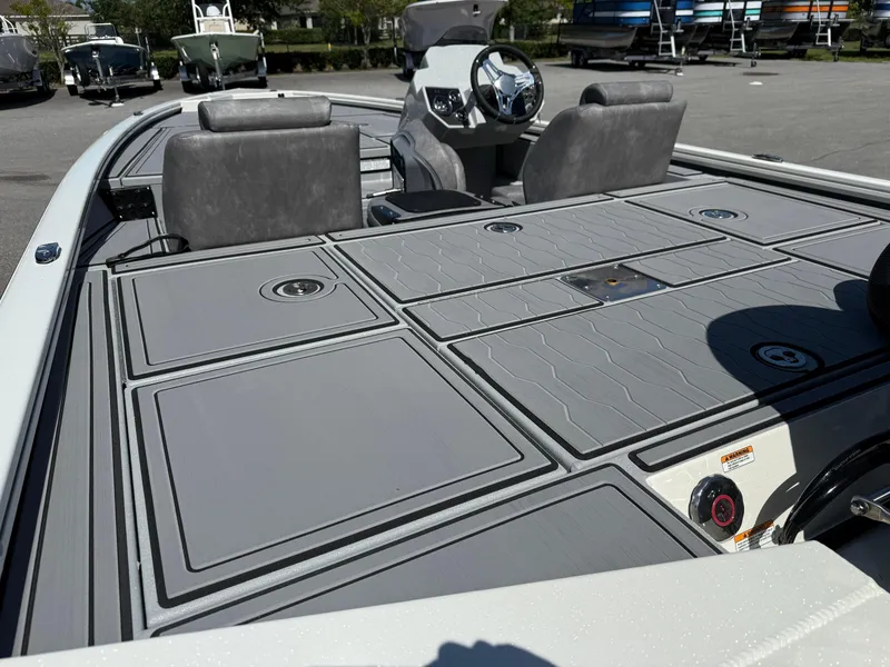Slide: The Image of 2025 Avid 18 XB boat with sleek gray deck and modern seating. - 8