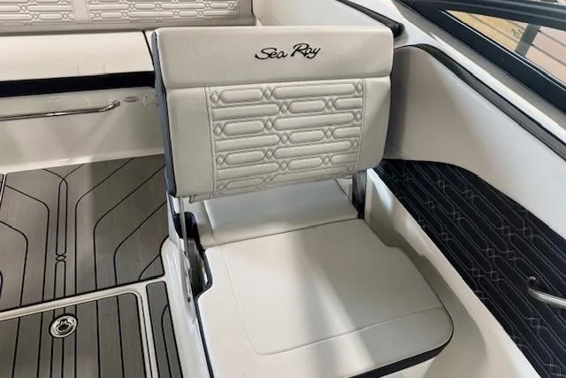 Slide: The Image of 2025 Sea Ray SPX 210 boat interior with stylish seating and modern design. - 13