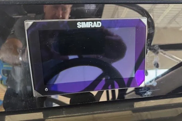 Slide: The Image of Simrad display on 2025 Sea Ray SPX 210 boat dashboard. - 14